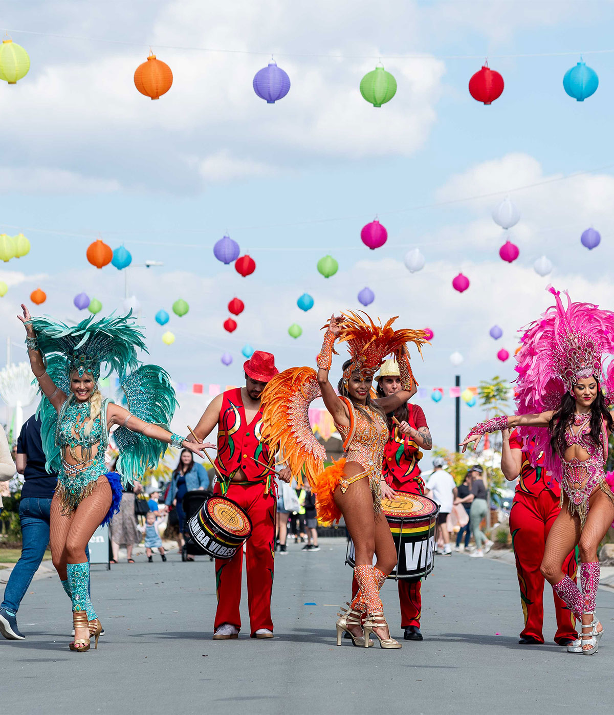 P3 Events community street parade activation with stilt performers and vibrant costumes